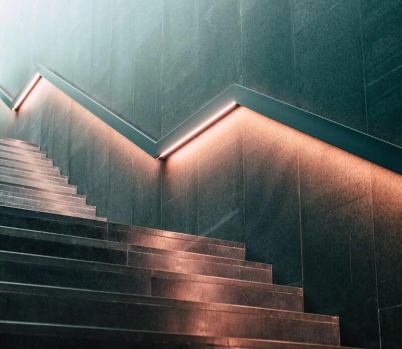 LED lighting under handrail by stairs from Lumilum